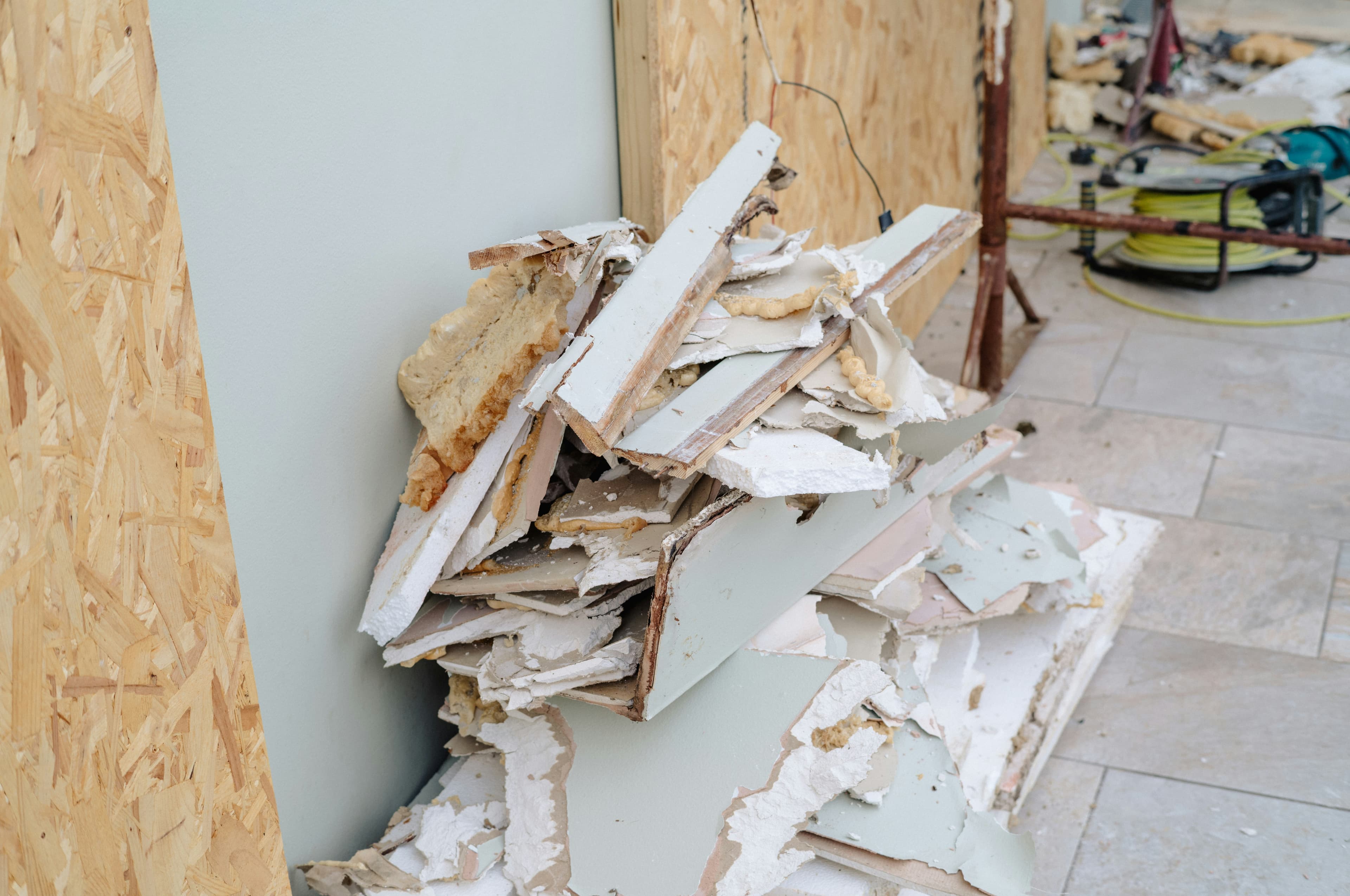 Construction debris and tools gathered at a work site